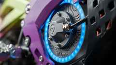 Close-up of a 79BIKE Falcon Pro Electric Dirt Bicycle wheel with purple and blue design