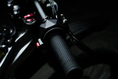 Close-up of 79BIKE Falcon Pro Electric Dirt Bicycle handlebar with dark background