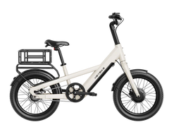 White children's bike with black wheels and a small basket on a white background