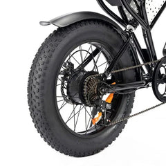 Close-up of a bicycle wheel with thick tire on a white background