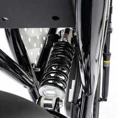 Close-up of a motorcycle suspension system with a white background