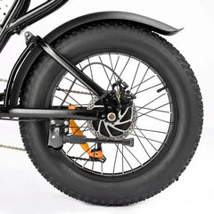 Close-up of a bicycle wheel with thick tire on a white background