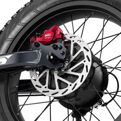 Close-up of a motorcycle wheel with a red brake caliper and KTET branding.