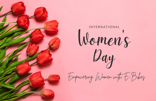 Red tulips on pink background with International Women's Day and empowering women with e-bikes text