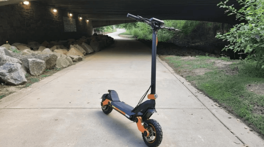 Electric scooter on outdoor path under bridge, Pogo Cycles quality e scooter store
